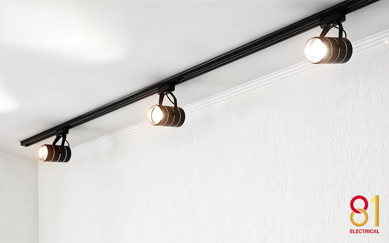 A set of track lighting installed on the ceiling