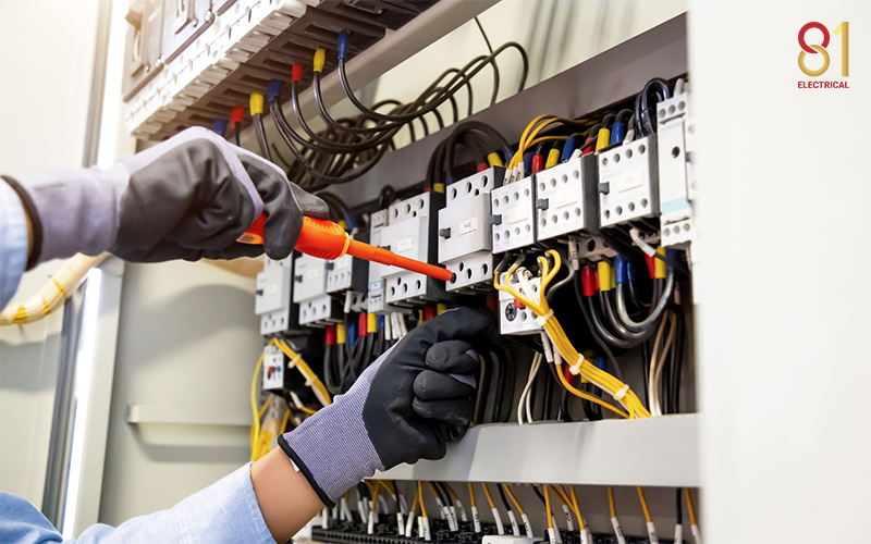 An electrician conducting electrical repair