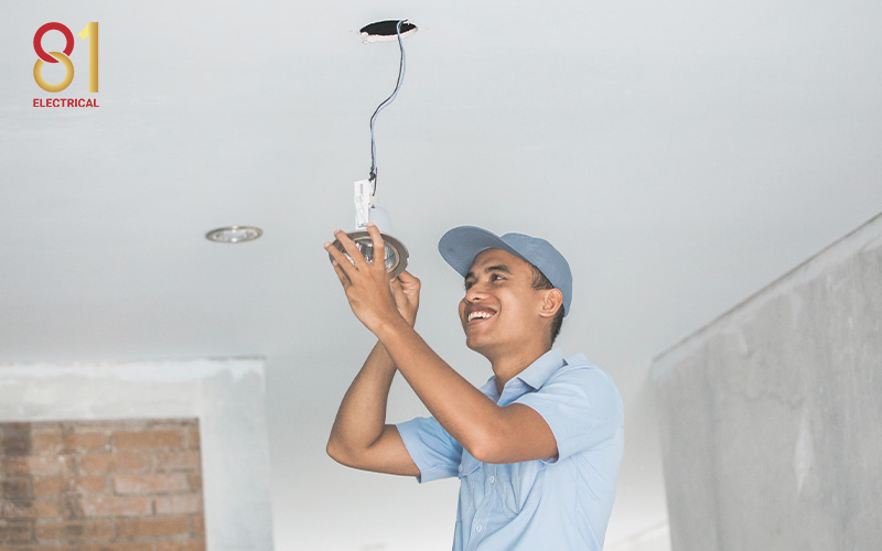 81 Electrical electrician installing a new false ceiling downlight.