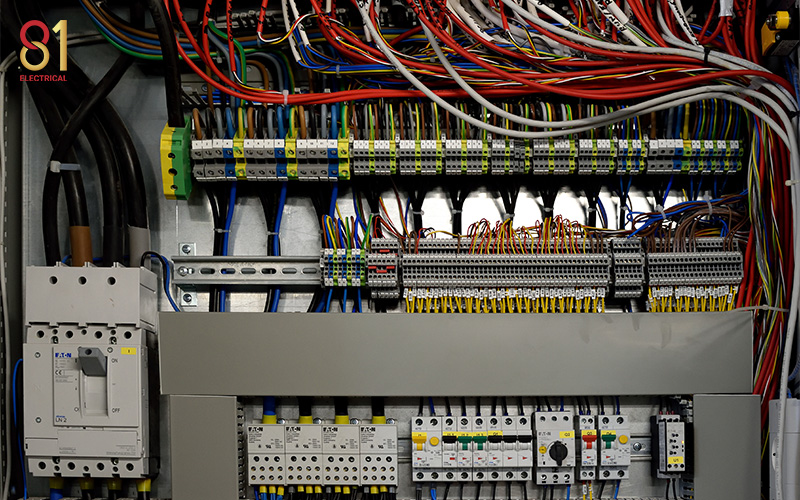 Complex wiring inside an automation control panel.