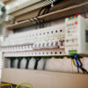 Electrical circuit breakers in a distribution board.