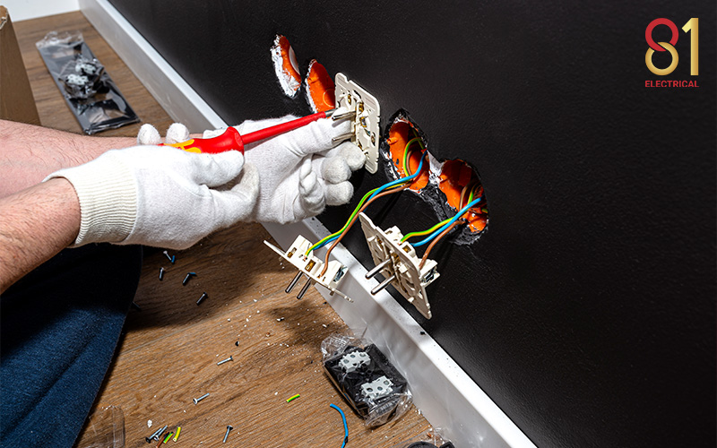Electrician installing new electrical outlets.