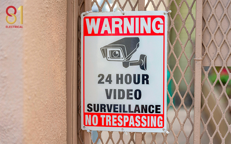 A sign warning of 24-hour video surveillance.
