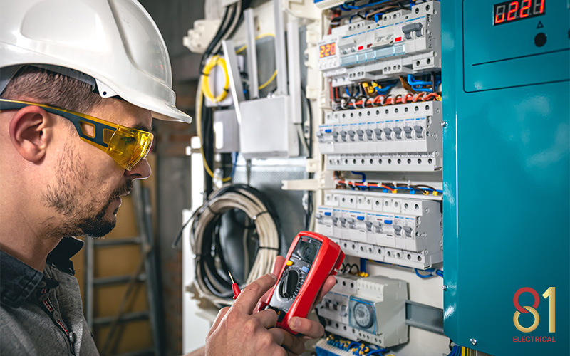 An electrician testing for unbalanced load