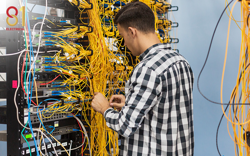 Engineer working on a cable rack.