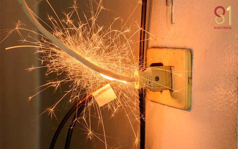 Sparks flying from a plug due to an unbalanced load