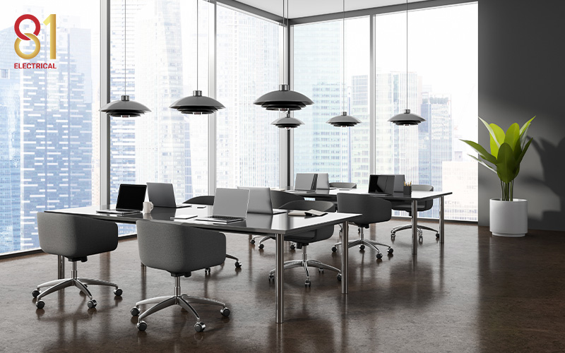 Workspace with a cityscape view and pendant lights.