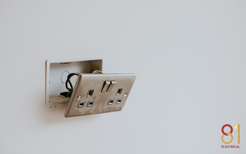Fallen light switch with exposed wires