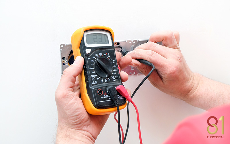 Voltage tester being used to check for a live current